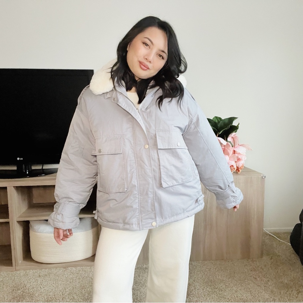 Powder blue puffer with a white faux fur collar